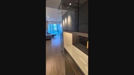 Room features: light wood flooring, glass partition, recessed downlights, built-in cabinetry, open layout, floor-to-ceiling windows, city view, neutral color palette; style: modern; view: city.