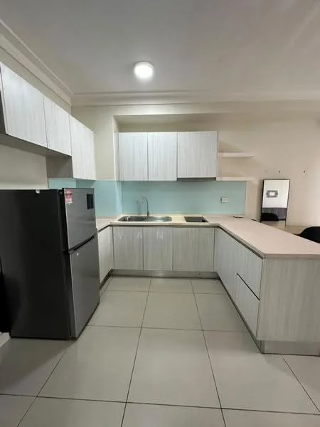 Kitchen features: light wood cabinetry, white laminate countertop, single-bowl stainless-steel sink, chrome pull-down faucet, built-in stove with two burners, refrigerator in stainless steel, glass backsplash, tile flooring, overhead cabinets, open shelving, recessed ceiling lights; style: modern.