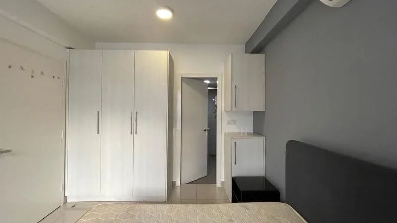 Bedroom features: grey accent wall, white painted walls, tile flooring, queen-size bed, built-in wardrobe with sliding doors, nightstand, door to hallway, ceiling light fixture, wall-mounted air conditioning unit; style: modern.