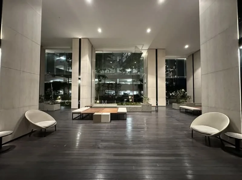 Room features: dark wooden flooring, large glass windows, concrete walls, modern lounge chairs, low wooden tables, indoor plants, ambient lighting, open layout; style: modern; view: garden.