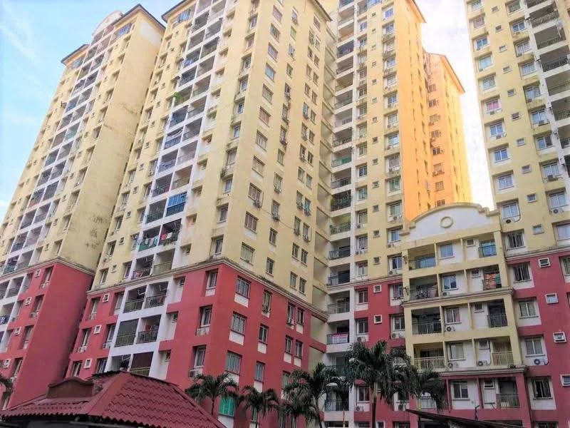 Exterior type: high-rise condominium; features: yellow painted facade, red painted facade, balconies with railings, multiple storeys, visible air conditioning units, landscaped area with palm trees, roof with tiles, windows with sliding glass, entrance with awning; style: modern.