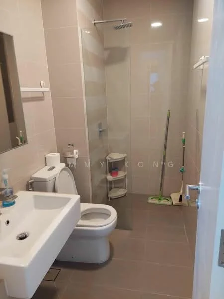 Bathroom features: white ceramic toilet, single-sink vanity with white cabinet, chrome basin mixer faucet, framed mirror, walk-in shower with glass enclosure, rain shower head, tile cladding on walls, grey ceramic tile flooring, toilet paper holder, shelf for toiletries, cleaning supplies visible; style: modern.