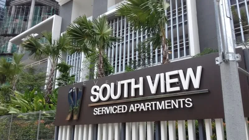 Exterior type: serviced apartment; features: signage with 'SOUTH VIEW' and 'SERVICED APARTMENTS', landscaped greenery with palm trees, modern architectural design, glass facade, metal railings, fenced perimeter; style: modern.