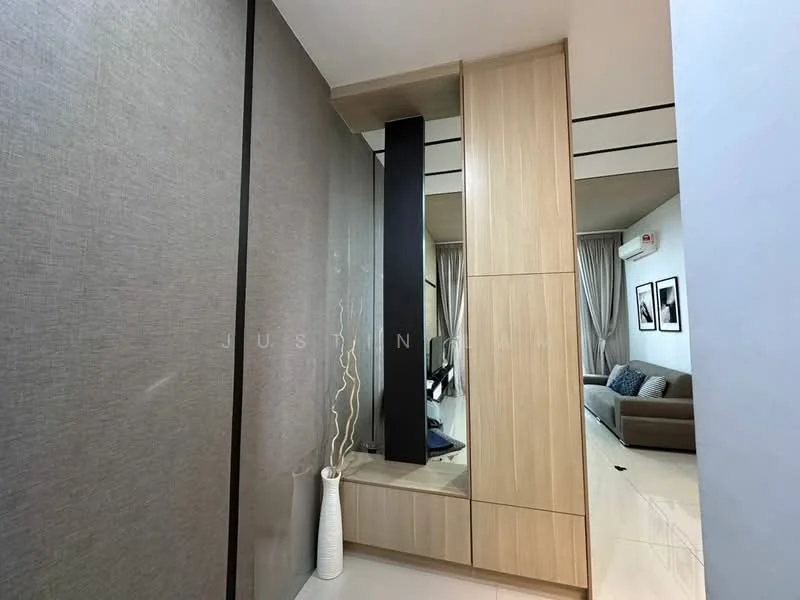 Room features: light grey textured wall, wooden cabinetry with light wood finish, black vertical feature panel, white ceramic vase, white floor tiles, recessed ceiling lights, curtains in neutral tone, sofa visible in background; style: modern.