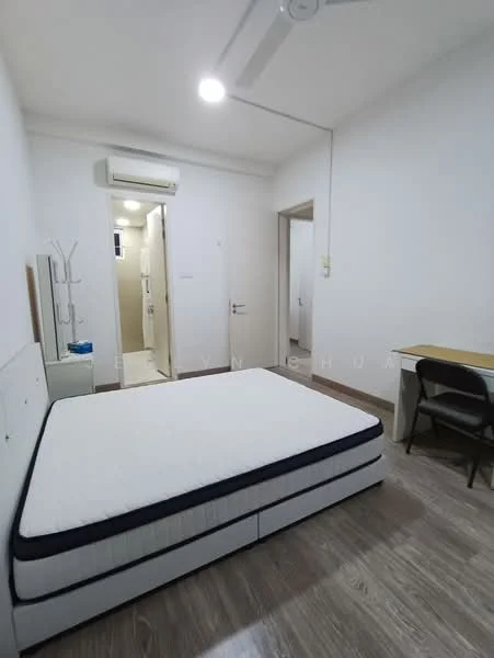Bedroom features: single bed frame without mattress, wooden flooring, white painted walls, ceiling fan, wall-mounted air conditioning unit, study desk, chair, built-in wardrobe, doorway leading to bathroom, light switch, window with natural light; style: minimalist.