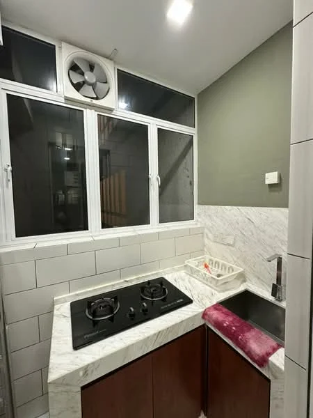 Kitchen features: marble countertop, brown wooden cabinetry, double-burner gas hob, stainless-steel sink, wall-mounted exhaust fan, white tiled backsplash, grey painted wall, window with white frames; style: modern.