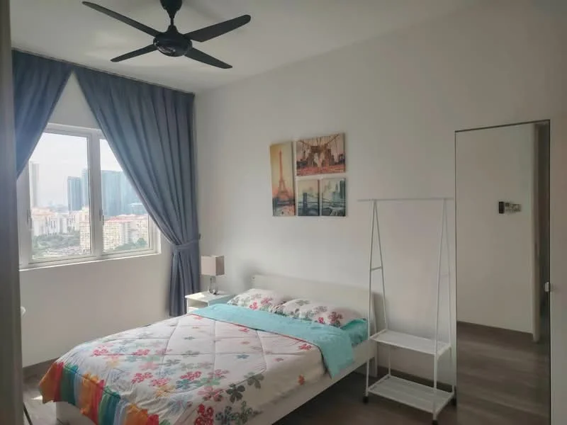 Bedroom features: queen-size bed with floral bedding, white bedside table, table lamp, floor-to-ceiling window, grey curtains, light wood flooring, ceiling fan, decorative wall art, white clothing rack, mirror on door; style: modern; view: city.
