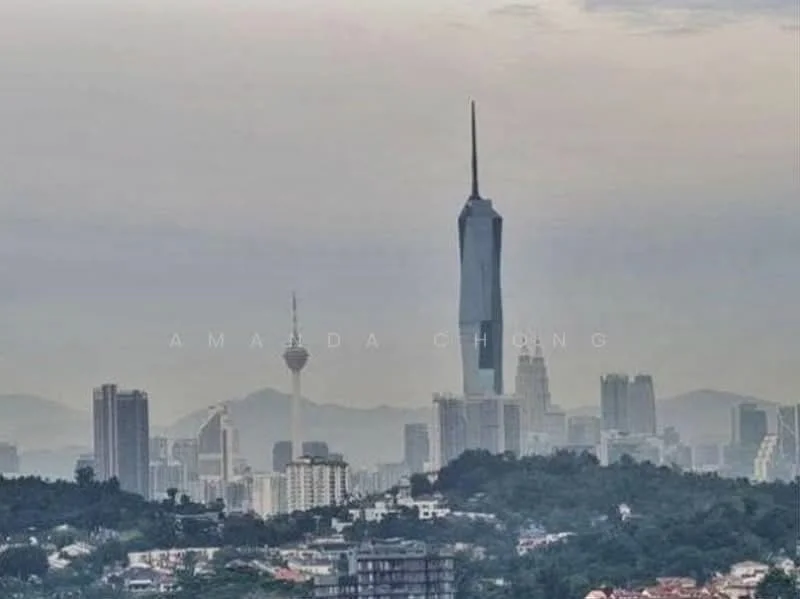 Exterior type: high-rise condominium; features: city skyline view, prominent tower in the background, surrounded by urban landscape, various high-rise buildings, greenery at the base, cloudy sky; style: modern.