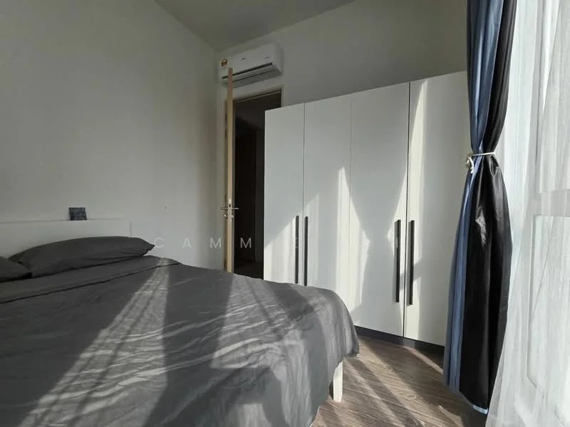 Bedroom features: queen-size bed with grey bedding, white wardrobe with black handles, floor-to-ceiling window with sheer curtains, wooden flooring, wall-mounted air conditioning unit, light grey painted walls, decorative item on bedside table; style: modern.
