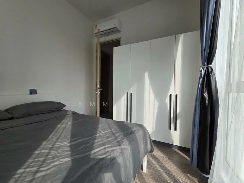 Bedroom features: queen-size bed with grey bedding, white wardrobe with black handles, wooden flooring, floor-to-ceiling window with sheer curtains, wall-mounted split AC, light grey painted walls, decorative wall art, door leading to another room; style: modern.