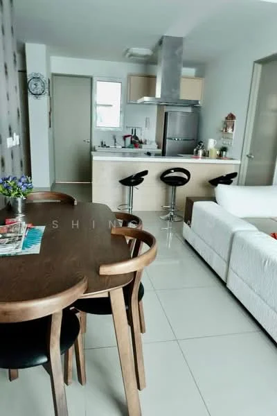 Living features: white fabric sofa, wooden coffee table, black dining chairs, round dining table, grey tiled flooring, kitchen island with bar stools, stainless-steel range hood, built-in oven, kitchen cabinets, wall clock, decorative wall with pattern, window with natural light; style: modern.