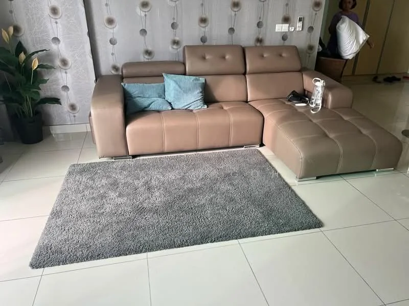 Living features: L-shape sectional sofa in light brown leather, decorative cushions in blue, area rug in grey, white tiled flooring, wall with floral pattern wallpaper, indoor plant in ceramic pot, glass side table, wall-mounted light switch; style: modern.