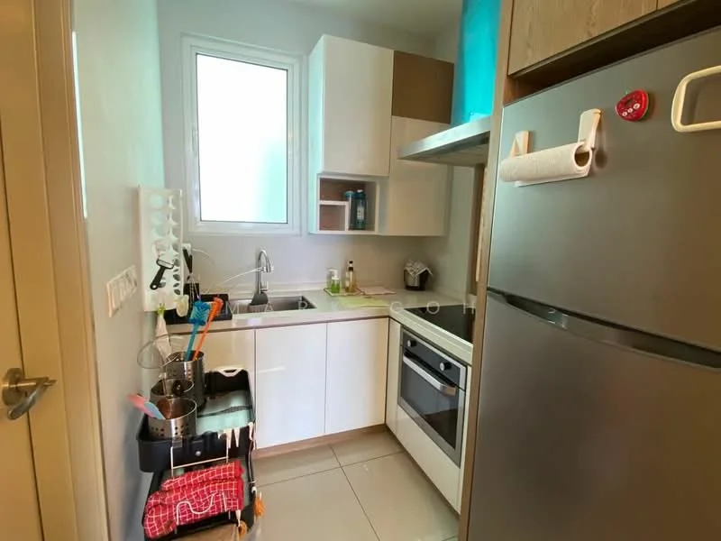 Kitchen features: white cabinetry, stainless-steel fridge, built-in oven, ceramic tile flooring, single-bowl stainless-steel sink, chrome pull-down faucet, countertop with light wood finish, window above sink, kitchen utensils on rack, dish drying rack, cleaning supplies on countertop; style: modern.
