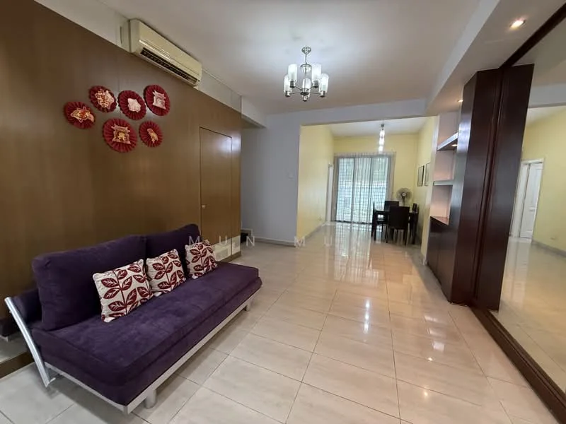 Living features: purple fabric sofa, decorative cushions with floral pattern, cream tiled flooring, wood panel accent wall, chandelier with multiple bulbs, wall-mounted air conditioning unit, large mirror on wall, sliding glass door leading to balcony, dining area visible in background, light yellow painted walls; style: contemporary.
