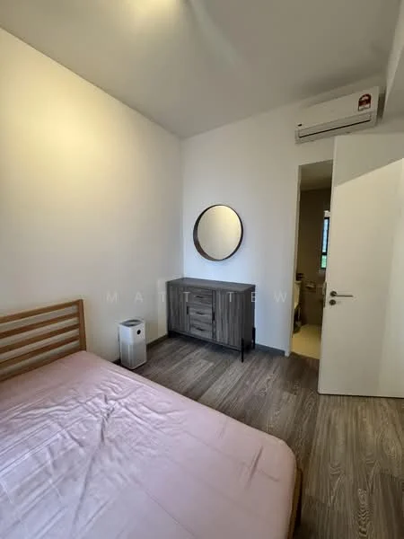Bedroom features: queen-size bed with pink bedding, wooden bed frame, wooden dresser with mirror, white walls, laminate flooring, 1 wall-mounted split AC, round mirror, door leading to bathroom, window with natural light; style: modern.