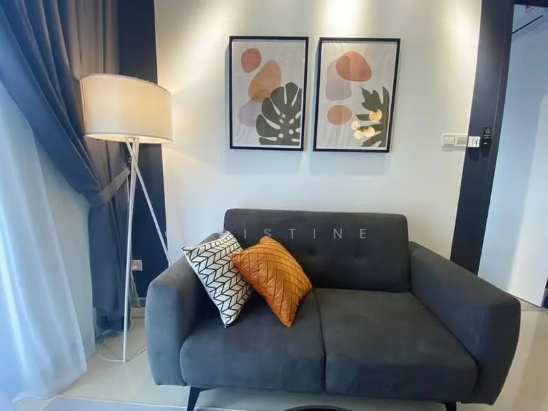 Living features: grey fabric sofa, decorative cushions in orange and black, floor lamp with white shade, framed artwork with abstract designs, light grey curtains, wall-mounted light fixture, neutral wall colour, tile flooring; style: modern.