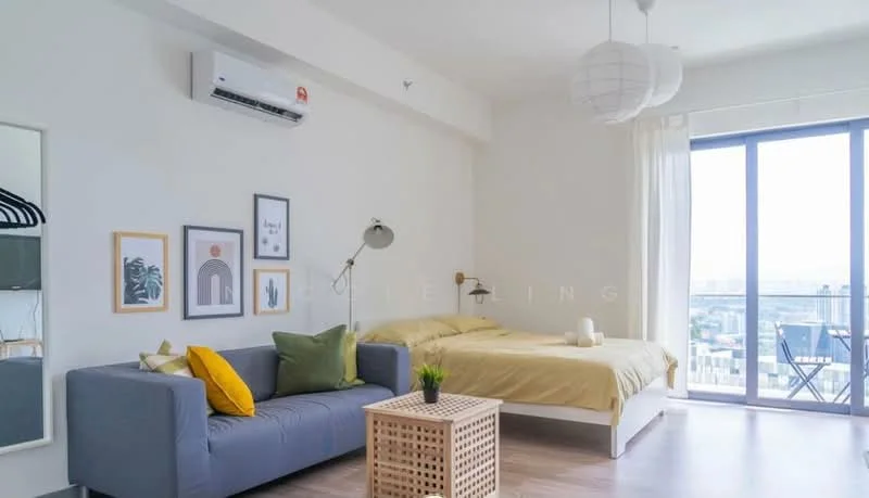 Room features: floor-to-ceiling windows, grey fabric sofa, wooden coffee table, queen-size bed with yellow bedding, decorative pillows in green and yellow, wall-mounted reading lamp, framed artwork on walls, white sheer curtains, air conditioning unit, light pendant lamps, wooden flooring; style: modern; view: city.