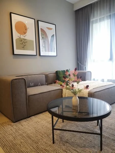 Living features: 3-seater fabric sofa in grey, coffee table with black glass top, area rug with geometric pattern, framed artwork on walls, floor-to-ceiling windows with sheer curtains, decorative vase with flowers, green throw pillow, curtains in light grey, neutral painted walls; style: modern.