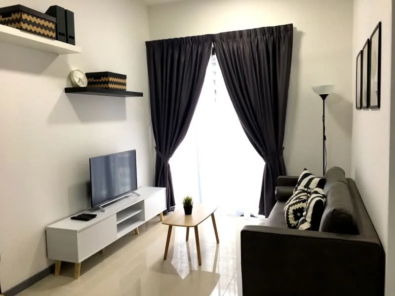 Living features: 3-seater brown leather sofa, white TV console, wall-mounted flat-screen TV, black floor lamp, light-colored coffee table, black and white decorative cushions, grey curtains, shelves with decorative boxes, glossy tiled flooring, plant in a pot; style: modern.