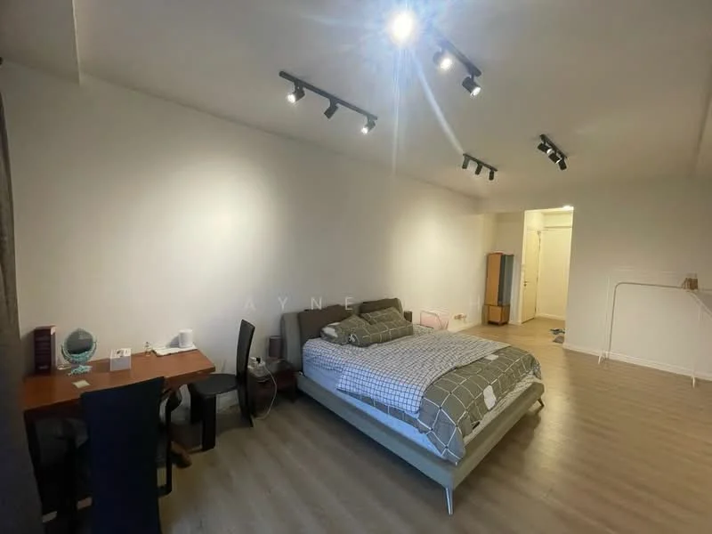 Bedroom features: queen-size bed with grey bedding, wooden flooring, white painted walls, track lighting, desk with chair, small bedside table, wardrobe, window with no visible treatment; style: modern.