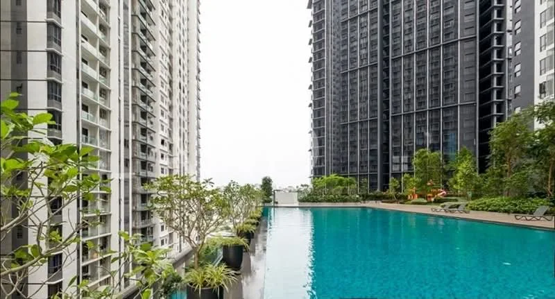 Exterior type: high-rise condominium; features: infinity pool, pool deck with loungers, landscaped garden, surrounded by greenery, modern architectural design, multiple high-rise buildings, water feature, outdoor seating area; style: modern.