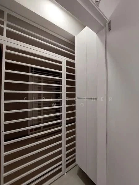 Room features: white painted walls, sliding door with horizontal metal bars, built-in white cabinetry, neutral flooring, modern design; style: modern.