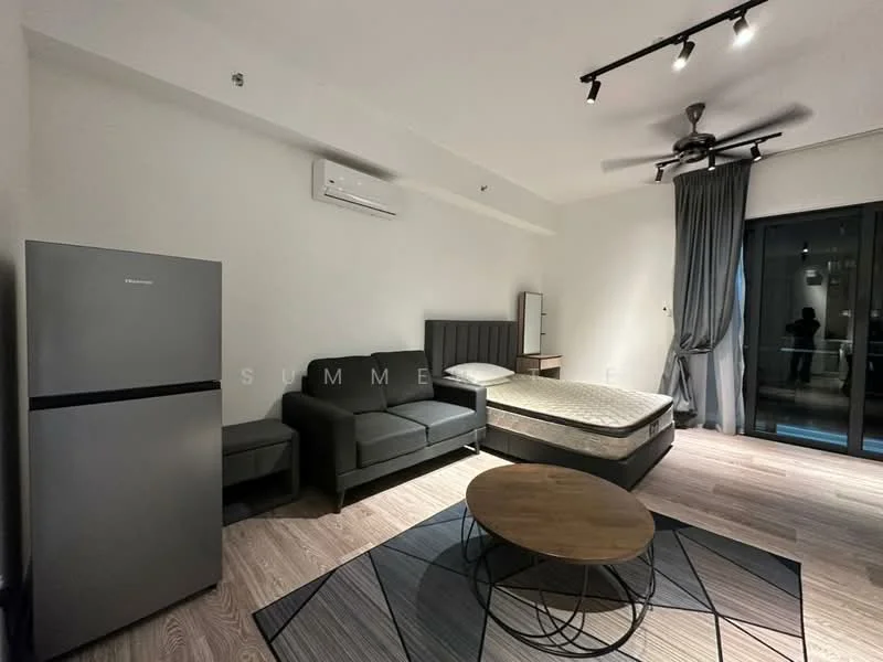 Living features: grey fabric sofa, round wooden coffee table, queen-size bed with mattress, stainless-steel fridge, wall-mounted split AC, ceiling fan with light, floor-to-ceiling sliding glass door, curtains, laminate flooring, neutral painted walls, recessed lighting; style: modern.