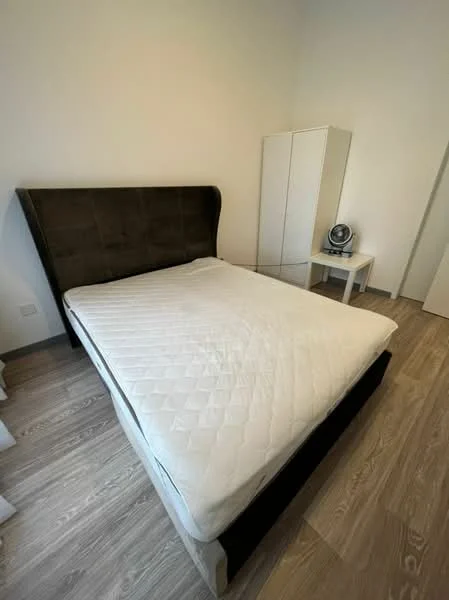 Bedroom features: king-size bed, upholstered headboard in dark fabric, light wood flooring, white walls, nightstand with drawer, white wardrobe, minimalist decor, natural light from window; style: modern.