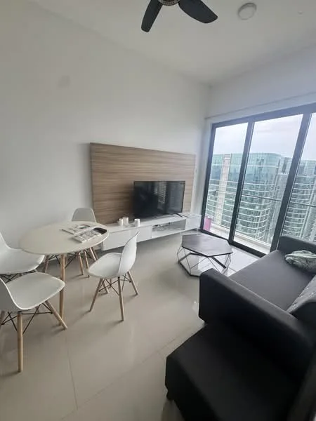 Living features: grey fabric sofa, white round dining table, 4 white dining chairs, flat-screen TV on wall-mounted unit, wood panel feature wall, large floor-to-ceiling windows, city skyline view, light-colored tile flooring, ceiling fan, decorative coffee table; style: modern; view: city.