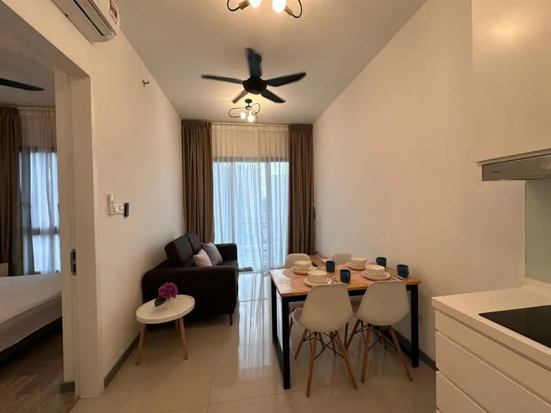 Living features: 5-blade ceiling fan with light, sofa in dark brown fabric, dining table with 4 white chairs, white walls, light-colored flooring, curtains in light brown, floor-to-ceiling windows, decorative flower in vase on table; style: modern. Room features: white cabinetry, kitchen countertop, built-in kitchen appliances.