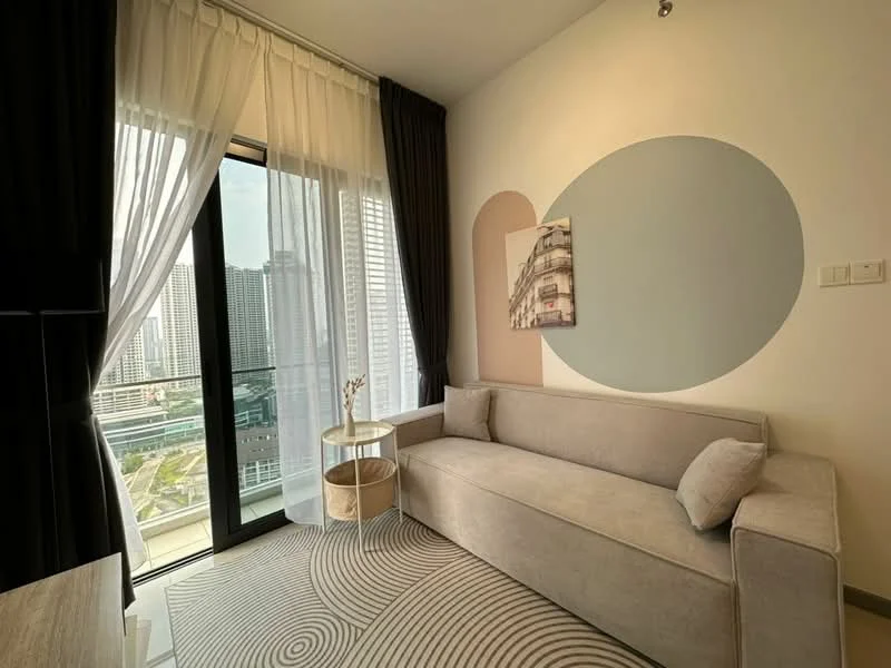 Living features: grey fabric sofa, round side table, floor-to-ceiling windows, sheer curtains, blackout curtains, decorative wall art, geometric wall design, area rug with abstract pattern; style: modern; view: city.