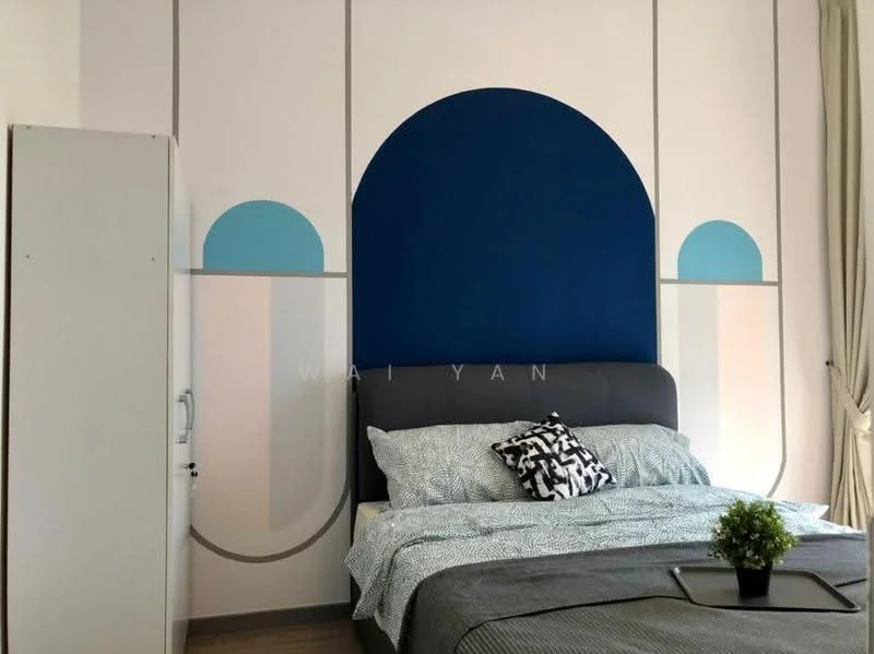 Bedroom features: blue accent wall, geometric wall design, queen-size bed with grey upholstered headboard, bedding in light grey with patterned throw, decorative black and white pillow, wooden flooring, white wardrobe, curtains in light fabric; style: modern.