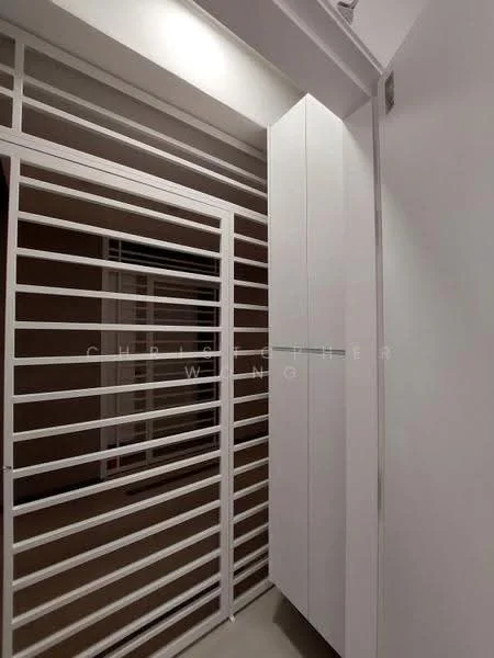 Room features: white painted walls, sliding door with horizontal slats, built-in white cabinetry, neutral flooring, modern design; style: modern.
