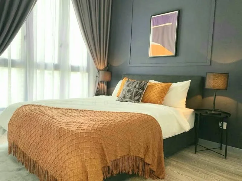Bedroom features: king-size bed, upholstered headboard, orange knitted throw blanket, white bedding, two bedside lamps, black nightstand, framed artwork on wall, floor-to-ceiling windows with sheer curtains, grey accent wall, wooden flooring; style: modern.