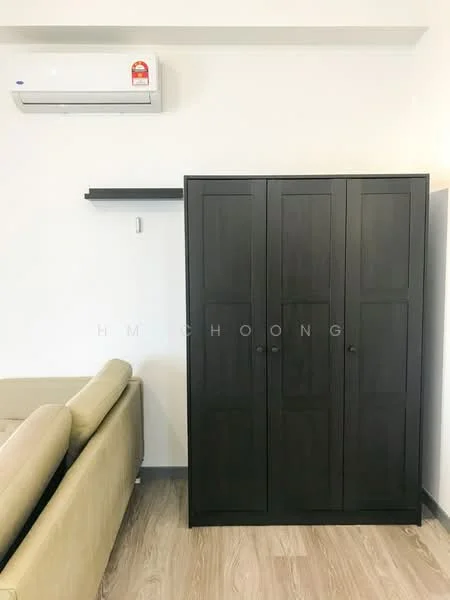 Room features: 1 wall-mounted split AC, dark wood wardrobe with three doors, light wood flooring, floating shelf above wardrobe, beige fabric sofa; style: modern.