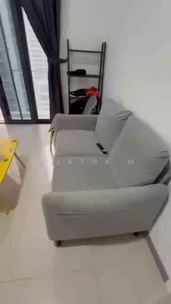 Living features: grey fabric sofa, yellow coffee table, floor-to-ceiling windows, black curtains, light-colored tiled flooring, open shelving unit, remote control on sofa; style: modern.