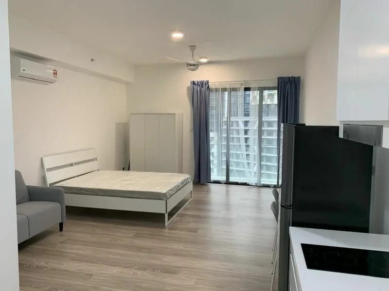 Room features: light wood laminate flooring, white painted walls, ceiling fan, 1 wall-mounted split AC, floor-to-ceiling sliding glass door, curtains, grey fabric sofa, queen-size bed frame without mattress, built-in wardrobe with sliding doors, black refrigerator, white kitchen cabinetry, black cooktop; style: modern.
