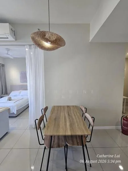 Dining features: wooden dining table, 4 metal dining chairs, pendant light fixture, white painted walls, tile flooring, air conditioning unit on wall, curtains, open layout to living area; style: modern. Room features: bed with white bedding, sofa in living area, floor-to-ceiling window, light-colored curtains.