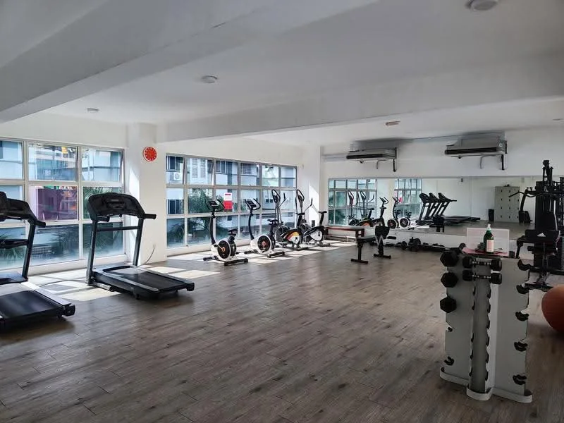 Room features: treadmill, stationary bike, weight bench, dumbbells, exercise mats, large windows, wooden flooring, ceiling lights, wall-mounted mirrors, air conditioning units; style: modern; view: garden.