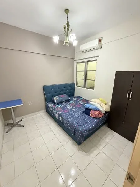 Bedroom features: queen-size bed with upholstered headboard, bedding with colorful patterns, white tiled flooring, wall-mounted split AC, single window with grid design, chandelier light fixture, small blue study table, dark wood wardrobe; style: modern.
