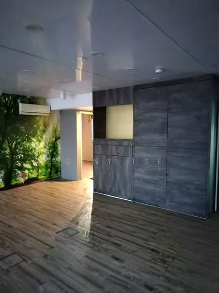 Room features: wooden flooring, grey accent wall, wall-mounted split AC, recessed ceiling, large window with garden view, built-in cabinetry, light fixtures, open layout; style: modern; view: garden.