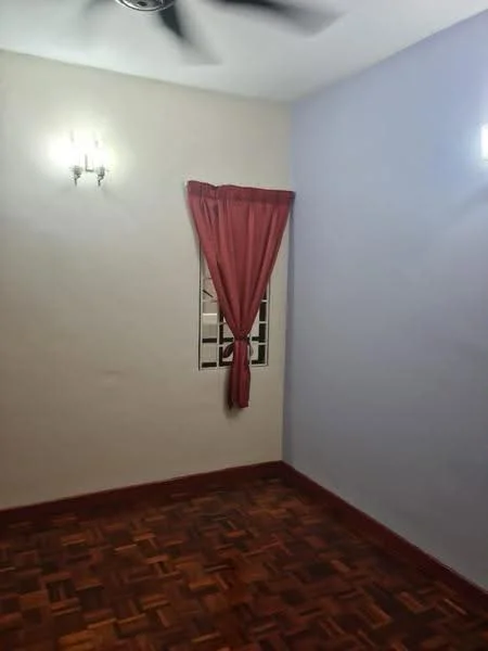 Room features: wooden flooring, painted walls in cream and light purple, window with white grilles, red curtain, 2 wall sconces, ceiling fan.