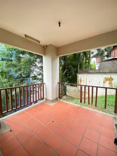 Room features: terracotta tile flooring, white painted walls, wooden railing, outdoor view of greenery, overhead light fixture; view: garden.