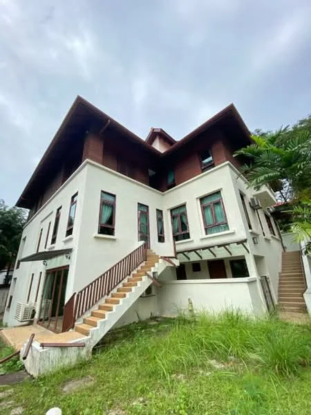 Exterior type: detached bungalow; features: white painted facade, brown wooden accents, multiple storeys, sloped roof, staircase leading to entrance, large windows, balcony on upper floor, manicured lawn, surrounded by greenery; style: modern.