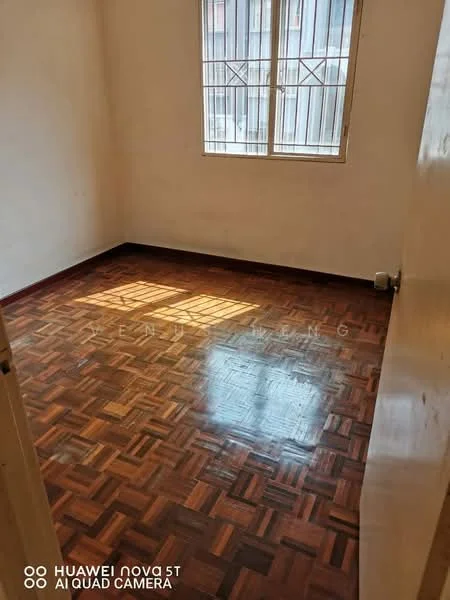 Room features: wooden flooring, white painted walls, two windows with metal grilles, natural light from windows, no visible furniture, plain ceiling, baseboards, corner of the room visible; style: minimalist.