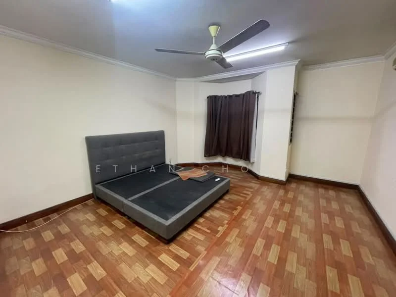 Bedroom features: wooden flooring, grey upholstered bed frame, ceiling fan, brown curtains, white painted walls, corner window, baseboard, power outlet.