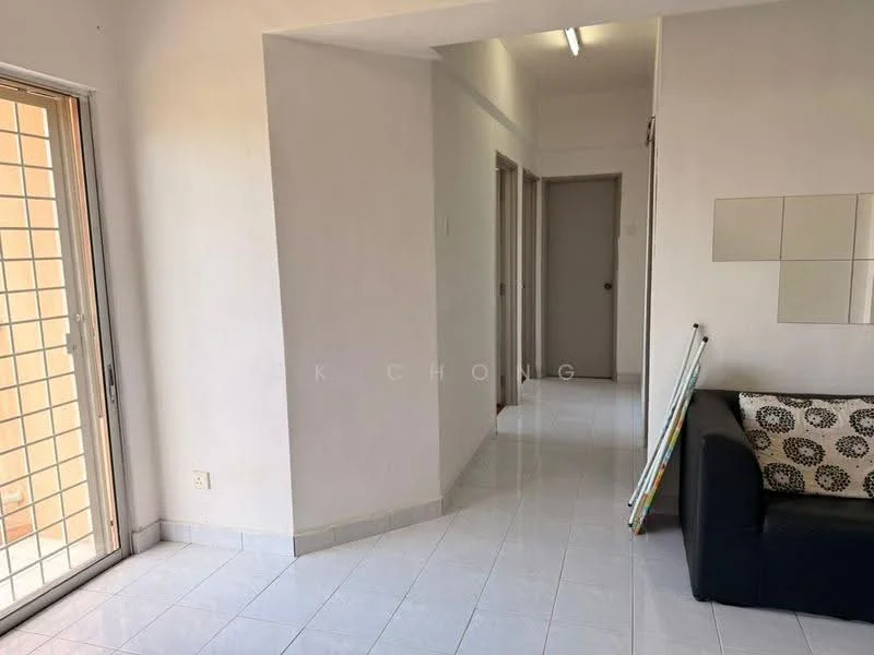 Room features: white painted walls, white tiled flooring, sliding glass door, natural light from door, mirror on wall, doorways leading to other rooms, sofa in dark color, decorative cushions on sofa.