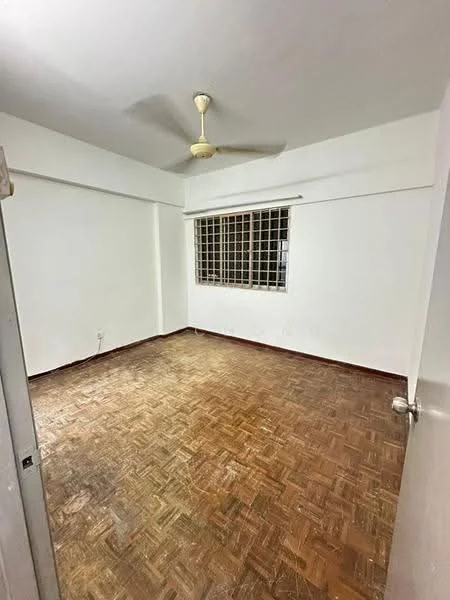 Room features: white painted walls, wooden flooring, ceiling fan, grid window, no visible furniture, empty space, natural light from window.