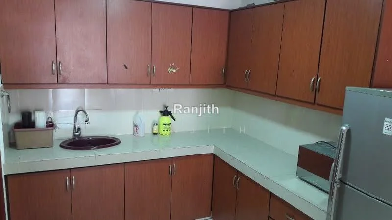 Kitchen features: brown wooden cabinetry, white countertop, single-bowl stainless-steel sink, chrome faucet, toaster, stainless-steel fridge, tile backsplash, wall-mounted cabinets.
