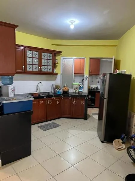 Kitchen features: brown wooden cabinetry, white tiled backsplash, stainless-steel sink, chrome pull-down faucet, black countertop, built-in refrigerator, freestanding stove, ceramic tile flooring, yellow painted walls, overhead ceiling light, window with frosted glass, open shelving, kitchen utensils visible, water dispenser; style: modern.